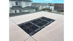 Commercial rooftop deck with NuraGrid system showing exposed grid structure