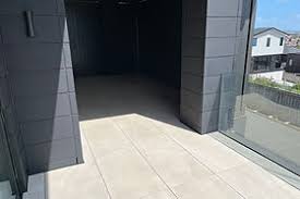 Modern architectural entrance with NuraGrid raised deck installation